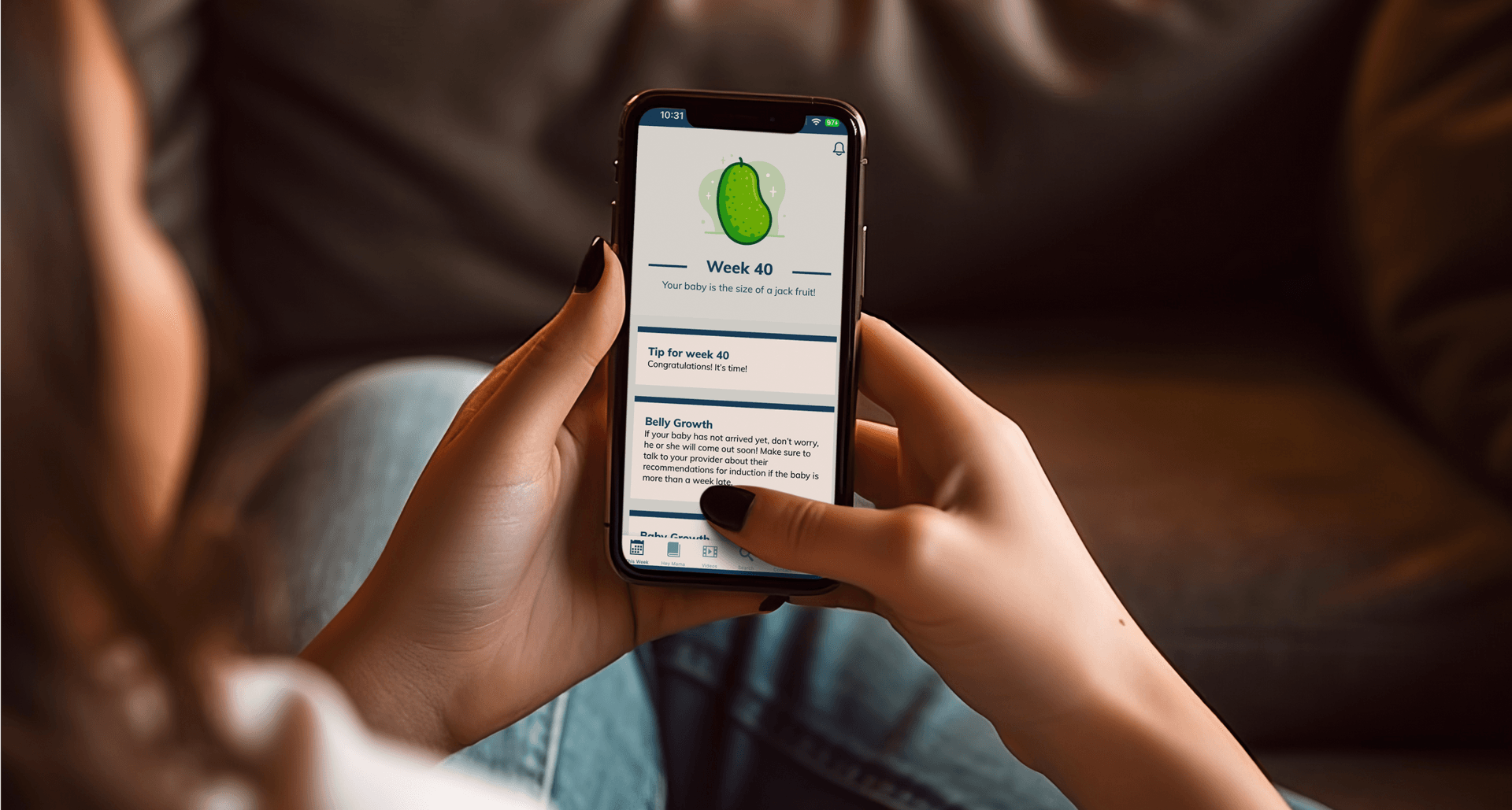 The "Hey Mama" app running on a phone. The user sees info related to week 40 of pregnancy including info on the size of the fetus and tips for the expectant parent.